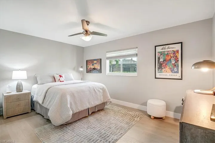Bedroom featuring light wood-style floors and a ceiling fan