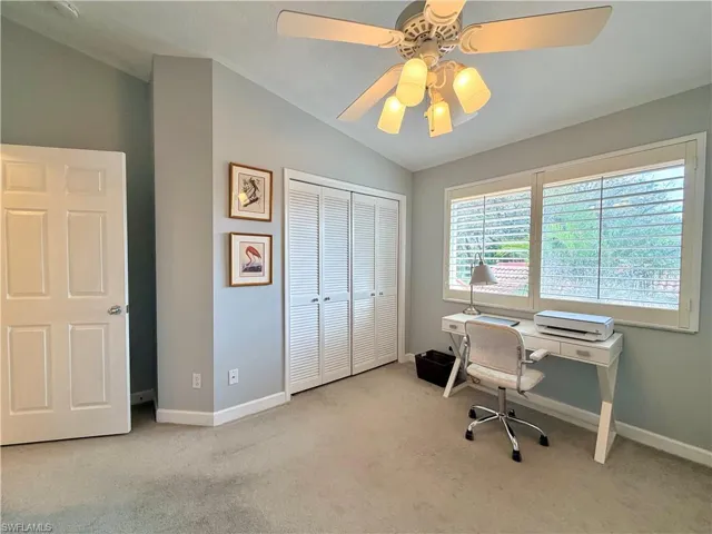Office with light carpet, vaulted ceiling, and ceiling fan , can be used as guest room with two Murphy beds in twin size