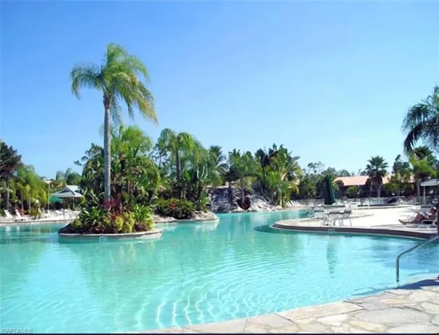 Community pool with a patio area