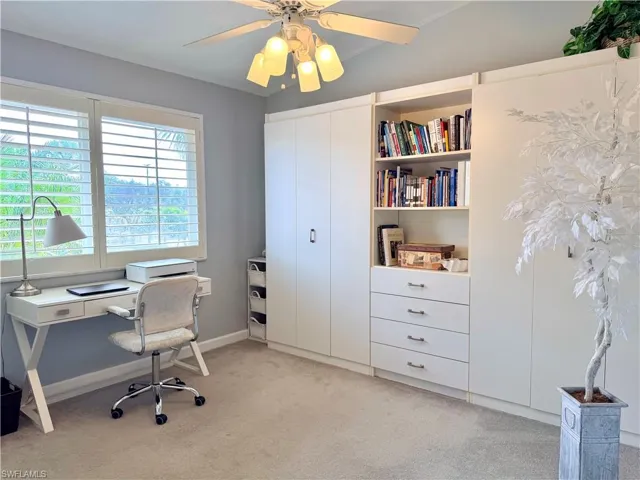 Office area with a ceiling fan, can be used as guest room with two Murphy beds in twin size