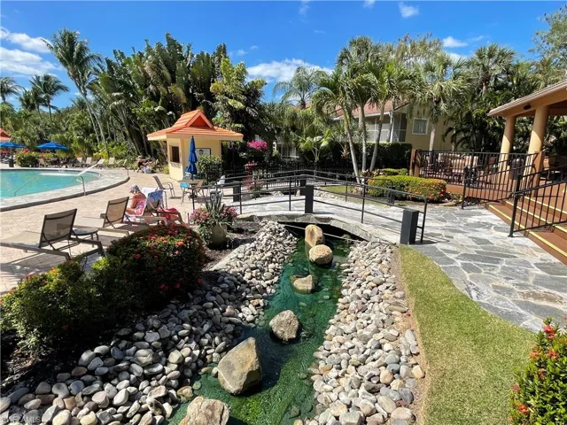 View of community with a patio and a swimming pool
