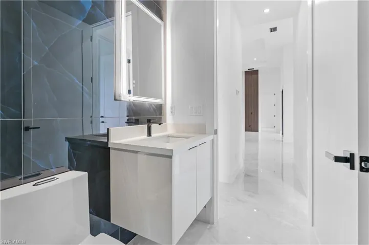 Bathroom with vanity and tile patterned floors