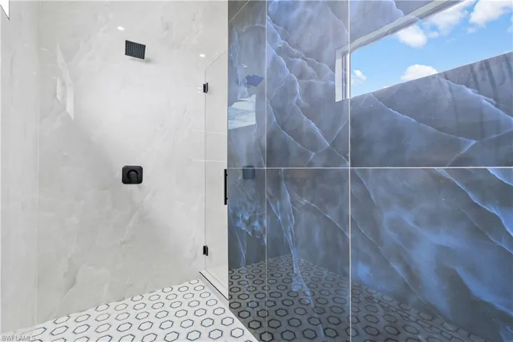 Master Bathroom featuring a tile shower