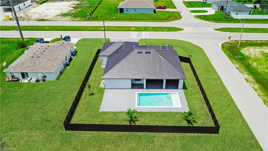 View of swimming pool with a lawn