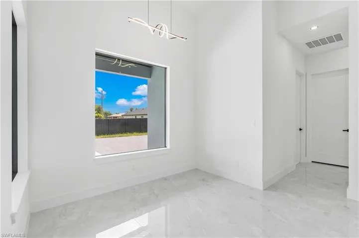 Unfurnished room with tile patterned flooring