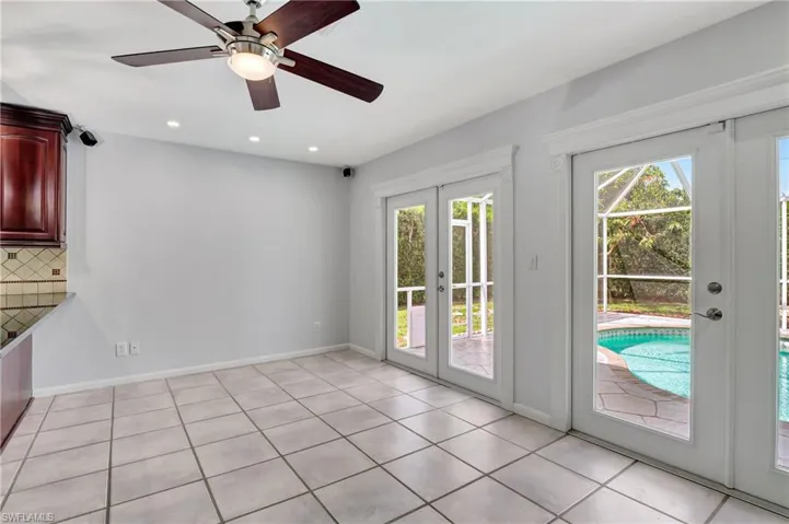 Entryway with french doors, ceiling fan, recessed lighting, and tile patterned flooring