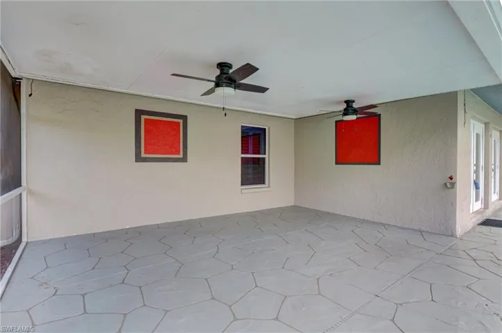 View of patio with a ceiling fan.