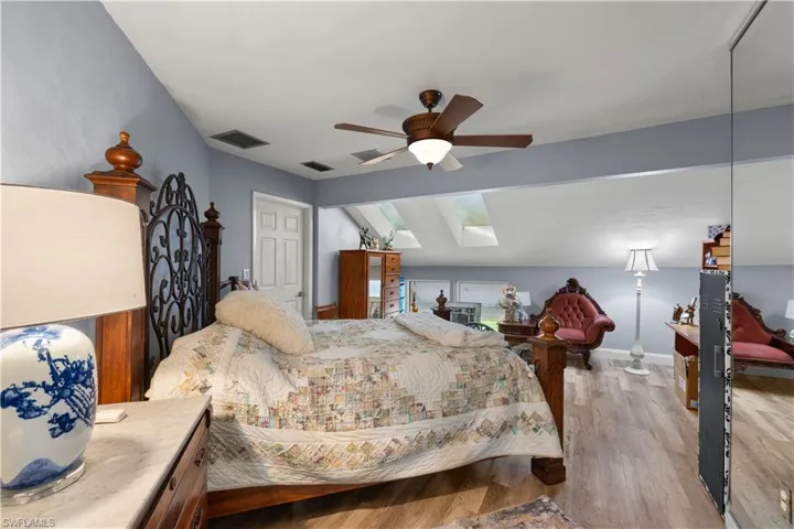 1st Guest Bedroom with vaulted ceiling and skylights