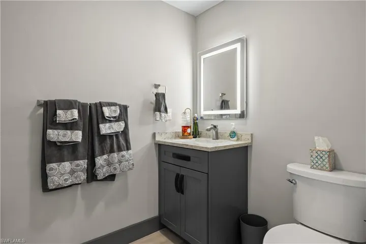 Half bathroom featuring toilet and vanity