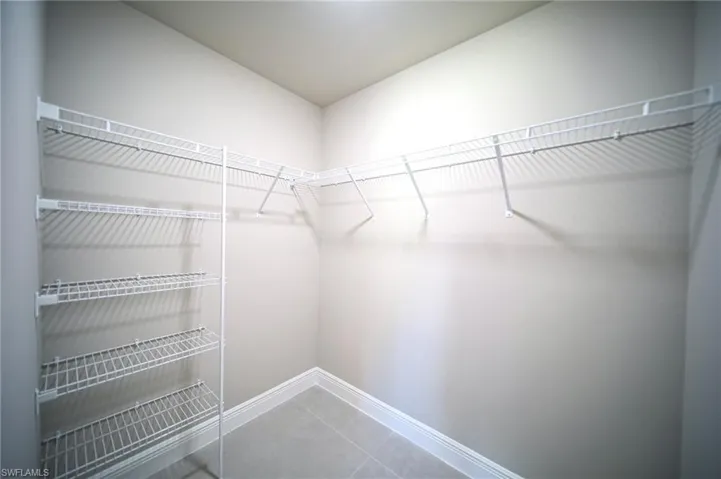 Large Master Bedroom Closet With Metal Shelving And Shoe Rack!
