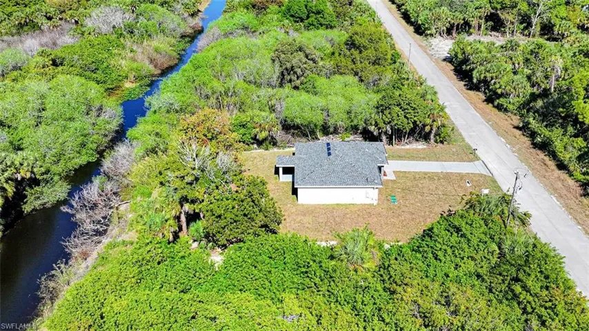 Side Aerial View Of Private Canal Lot!