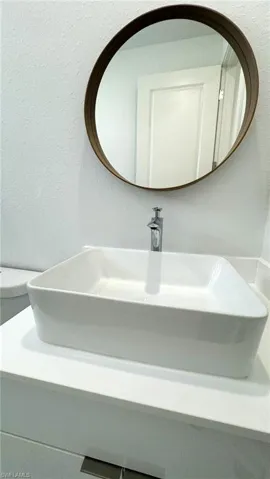 Bathroom with toilet and vanity
