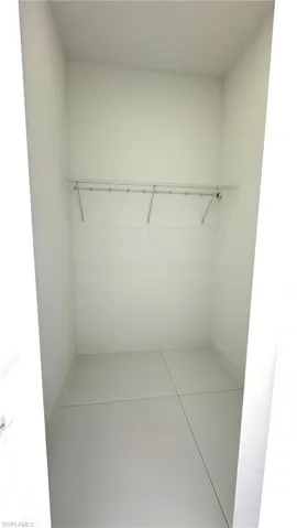 Walk in closet featuring tile patterned floors
