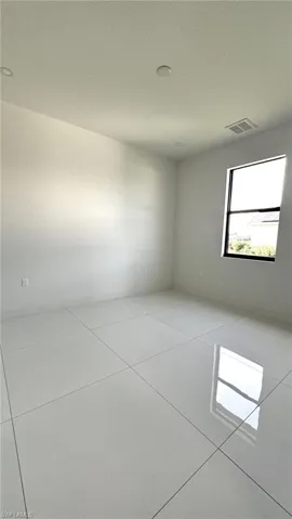 View of tiled spare room