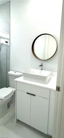 Bathroom with toilet and vanity