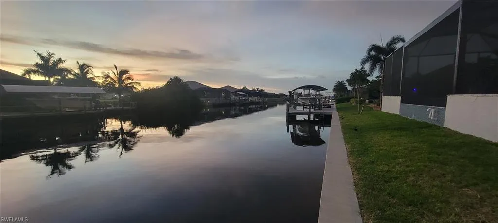 View of water feature with a boat dock