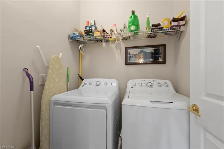 Clothes washing area featuring independent washer and dryer