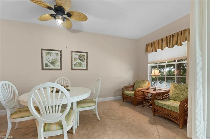 Tiled dining space with ceiling fan
