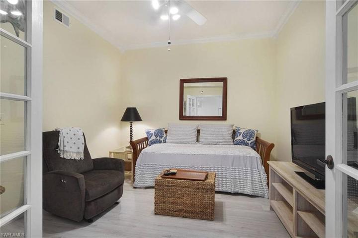 Den with trundle bed recliner TV desk bookshelves