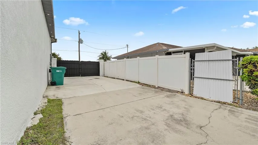 View of patio featuring a gate
