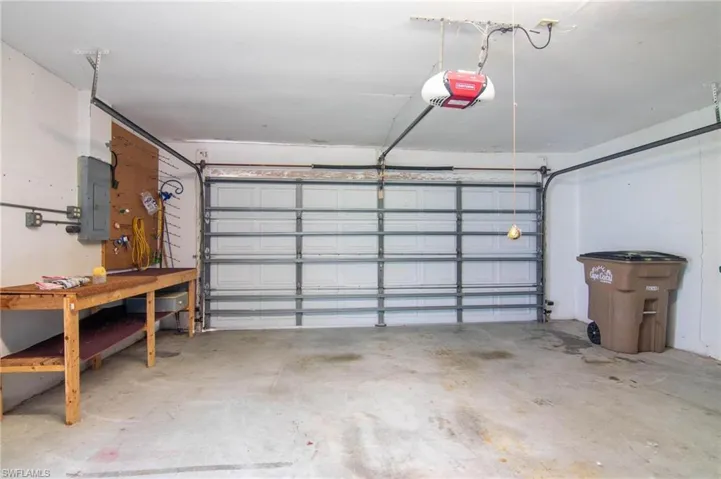 Two car garage with automatic garage door opener.
