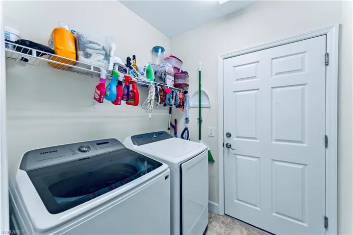 Laundry room featuring independent washer and dryer and laundry area