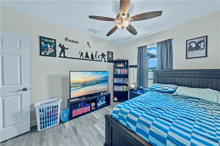 Bedroom featuring wood finished floors and a ceiling fan