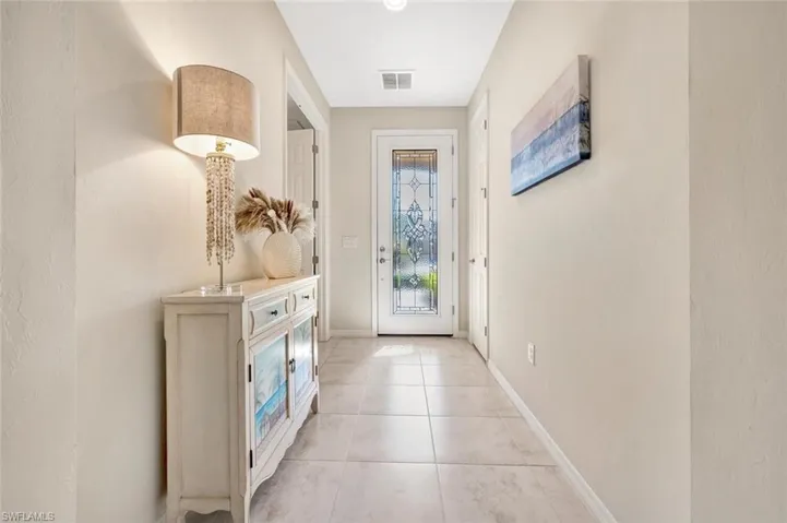 Entry looking to beautiful glass front door