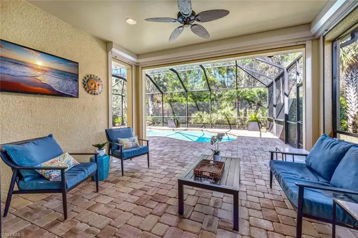 Cocktails, anyone? Privacy with a preserve behind the pool cage.