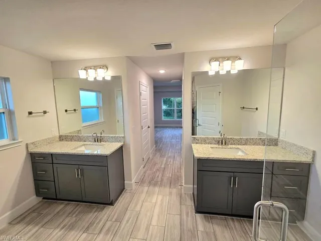 Bathroom featuring vanity and wood-type flooring