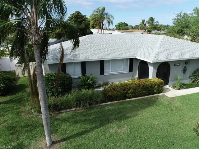 Single story home featuring a front lawn