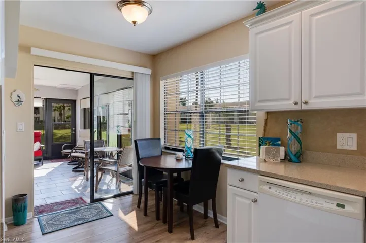 Dining space with healthy amount of natural light and light wood-style flooring