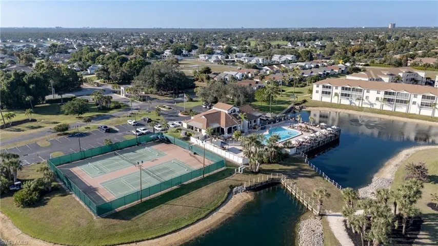 Aerial view of property's location with a large body of water