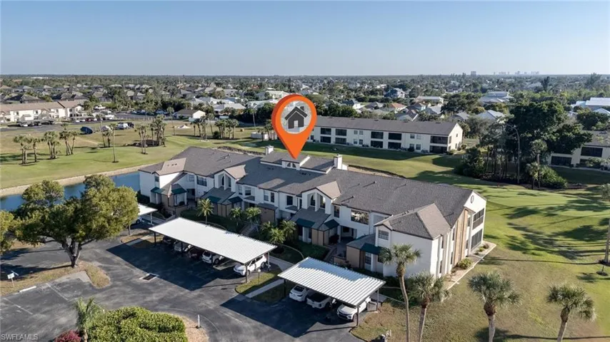 Aerial perspective of suburban area featuring a local golf course