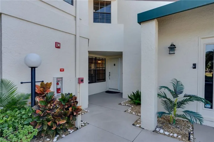 View of exterior entry with stucco siding