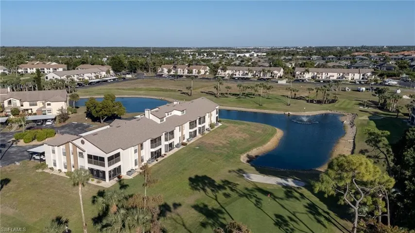 Aerial overview of property's location featuring a large body of water and nearby suburban area