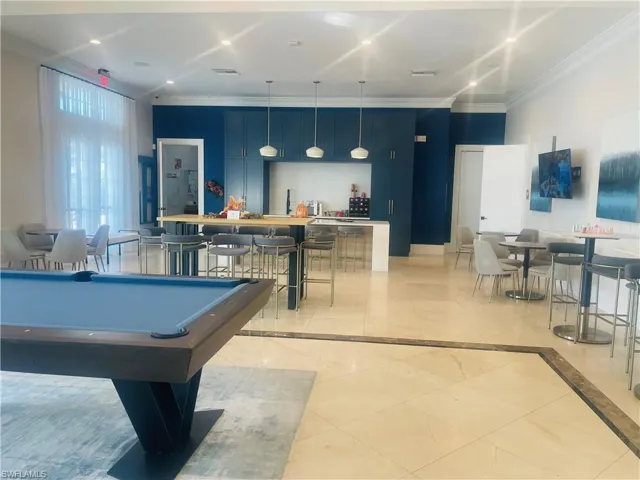 Rec room with billiards table, crown molding, and recessed lighting