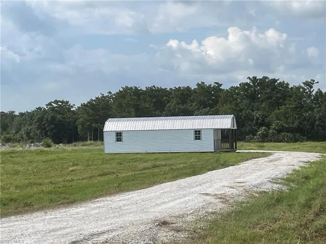 View of new driveway leading to the 50x50 building pad and 12x40 shed