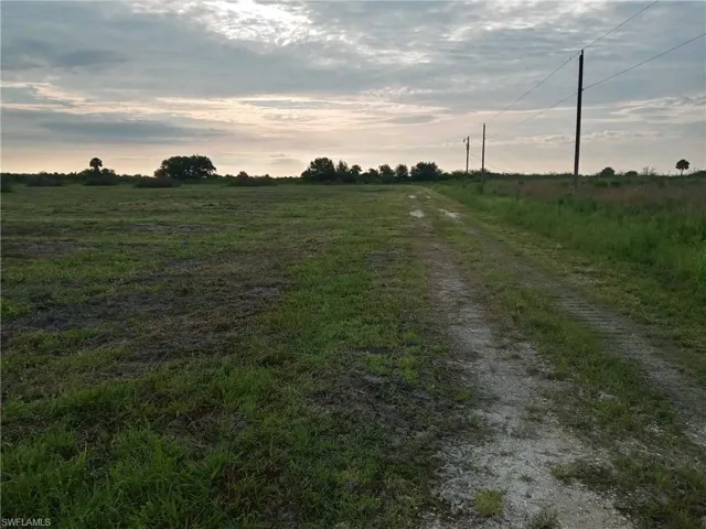 View of 46310 Neal Rd on left. FPL Power pole on right