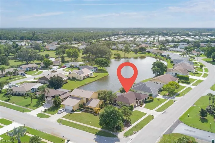 Aerial overview of property's location featuring nearby suburban area and a large body of water