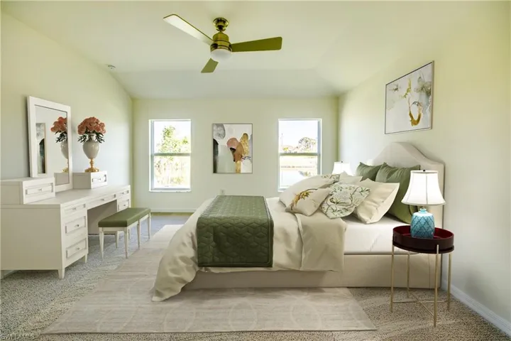 Bedroom featuring lofted ceiling and ceiling fan
