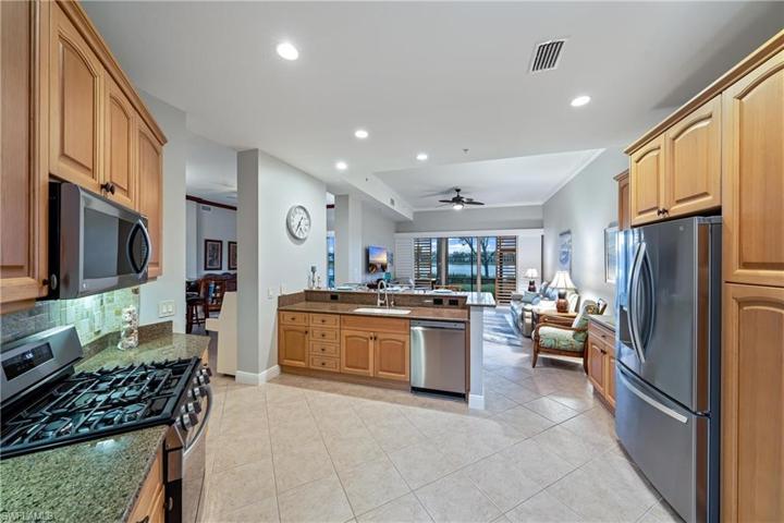 Kitchen boasts gas range and sleek stainless appliances
