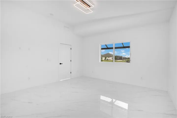 Empty room featuring baseboards and light marble finish flooring