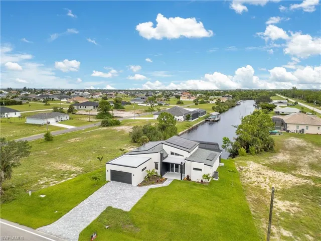 Aerial view of residential area with a nearby body of water
