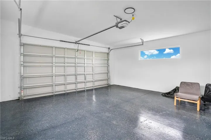 Garage featuring a garage door opener