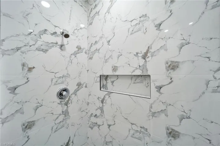 Interior details featuring tiled shower