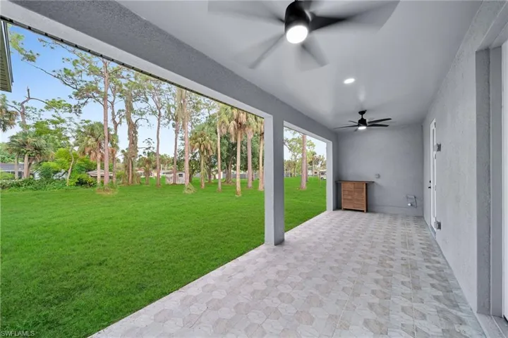 View of patio featuring ceiling fan