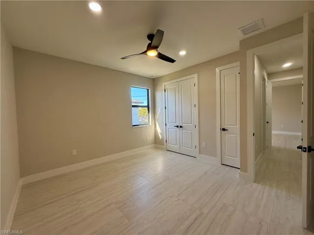 Unfurnished bedroom featuring a closet, ceiling fan, recessed lighting, and light wood-style flooring