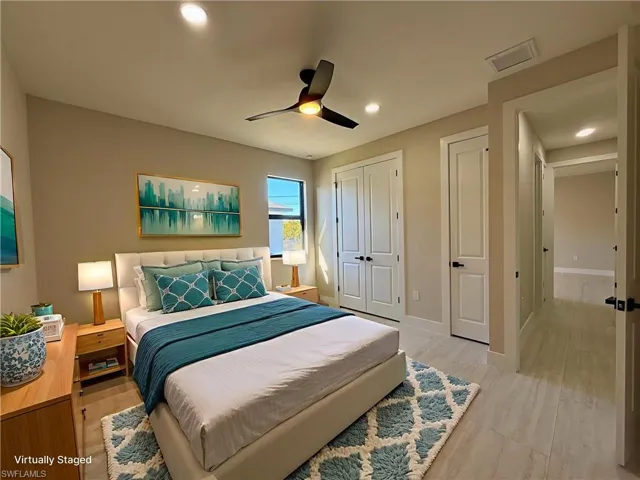 Bedroom with a closet, a ceiling fan, recessed lighting, and light wood finished floors