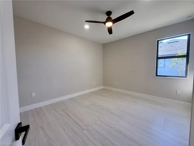 Unfurnished room with ceiling fan, light wood-type flooring, and recessed lighting